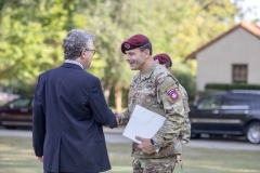 U.S. Army Maj. Gen. Christopher T. Donahue (right), Commanding General of the 82nd Airborne Division, shakes hands with Peter Stern (left), President of the 9th Infantry Division Association, during a memorial service on Fort Bragg, North Carolina, October 1, 2021.  The 76th Annual Reunion Memorial Service honored the 9th Infantry Division which served on Fort Bragg during World War II. (U.S. Army Photo by Spc. Jacob Moir)