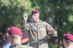 U.S. Army Maj. Richard Winkels, Director of the 82nd Airborne Division Band, conducts during a memorial service on Fort Bragg, North Carolina, October 1, 2021.  The 76th Annual Reunion Memorial Service honored the 9th Infantry Division which served on Fort Bragg during World War II. (U.S. Army Photo by Spc. Jacob Moir)